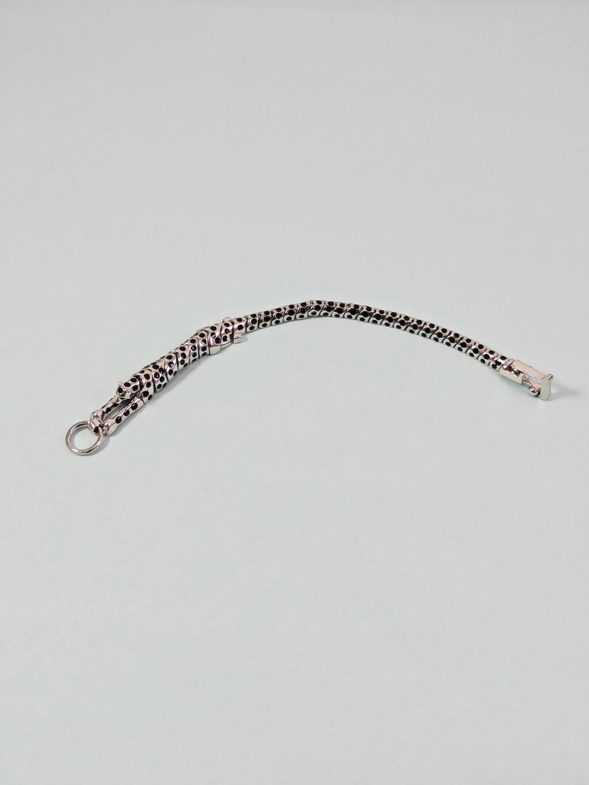 Bracelet with leopard print pattern on a light gray background